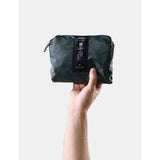 Matador 18L waterproof packable backpack in juniper green, shown folded and unfolded, lightweight and durable for outdoor use.
