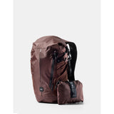 Matador 18L waterproof packable backpack in garnet color, shown folded and expanded, with adjustable shoulder straps.