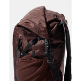 Matador 18L waterproof packable backpack in garnet color, shown folded and partially unfolded, ready for outdoor use.