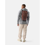 Matador 18L waterproof packable backpack in garnet, shown folded and partially unfolded with waterproof material visible.