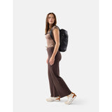 Black Matador 18L packable backpack made of lightweight, durable material, shown unfolded with adjustable straps.