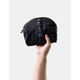Black Matador 18L packable backpack shown open, lightweight and compact, designed for travel and outdoor use.