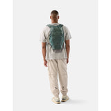 Matador 18L packable backpack in juniper green, lightweight and foldable for easy carrying and storage.