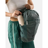 Matador 18L packable backpack in juniper green, lightweight and foldable for easy carrying and storage.