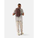 Red Matador 18L packable backpack shown folded and unfolded, lightweight and compact for travel and outdoor use.