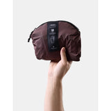 Matador 18L packable backpack in garnet color, lightweight and foldable for easy carrying and storage.