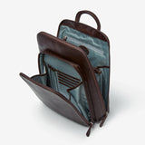 Osgoode Marley RFID organizer backpack in espresso color, showing side view with multiple compartments and sturdy straps.