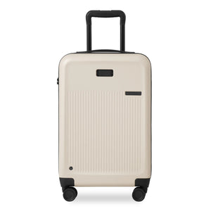 Briggs & Riley Sympatico Essential Expandable Carry-On Spinner luggage in ivory, front view showing wheels and telescoping handle.