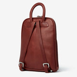 Osgoode Marley small organizer backpack in tan leather with multiple compartments and adjustable straps.