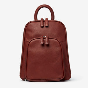 Osgoode Marley small organizer backpack in brown with front zipper pockets and adjustable straps, designed for everyday use.