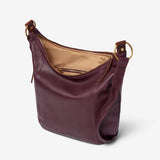 Osgoode Marley Tammi Hobo handbag in mulberry leather, shown from side view with spacious design and stylish handle details.