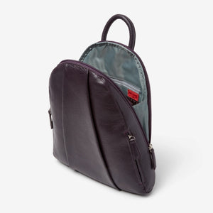 Osgoode Marley teardrop-shaped multi-zip backpack in plum color, showing side view with multiple zip compartments and adjustable straps.