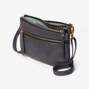 Osgoode Marley Virginia Small Crossbody bag in storm gray with adjustable strap and exterior pocket, displayed from side view.