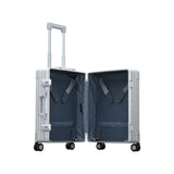 Silver Aleon 21-inch classic carry-on suitcase with hard shell and spinner wheels, ideal for travel and easy maneuvering.