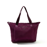 Baggallini Carryall expandable tote bag with handles, showing its large, packable design perfect for travel and everyday use.
