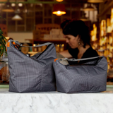 Bellroy Lite Cooler Caddy 6L in gray with insulated design and carrying handle, ideal for keeping beverages and snacks cool.