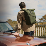 Bellroy Classic Rolltop backpack with sleek black fabric, roll-top closure, and adjustable straps, designed for daily use and organization.