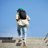 Black Bellroy Lite Ready Pack backpack with sleek design, multiple compartments, and padded straps for comfortable carrying.