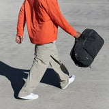 Black Bellroy Lite Travel Pack backpack with 30L capacity, featuring multiple compartments and padded shoulder straps.