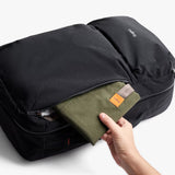 Black Bellroy Lite Travel Pack backpack with 30L capacity, featuring multiple compartments and padded shoulder straps for comfortable travel.