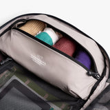 Black Bellroy Lite Travel Pack 30L backpack with padded shoulder straps and multiple compartments, designed for travel and daily use.