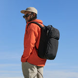 Bellroy Lite Travel Pack 38L backpack with multiple compartments, black fabric, padded shoulder straps, and sleek design.