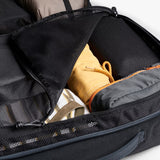 Bellroy Lite Travel Pack 38L backpack with multiple compartments, black fabric, and padded shoulder straps for comfortable travel.