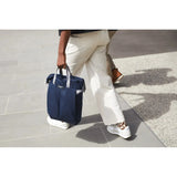 Bellroy Tokyo Totepack Compact backpack with sleek black design, multiple compartments, and adjustable straps on a plain background.