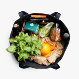 Bellroy Market Tote 15L showing durable black canvas exterior with leather handles and spacious interior for daily shopping or errands.