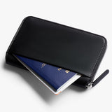 Bellroy Travel Folio 2nd Edition open showing multiple compartments for travel documents, cards, and a passport.