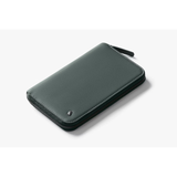 Bellroy Travel Folio 2nd Edition open with passport, cards, and boarding pass inside, showcasing sleek leather travel organizer.