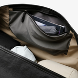 Bellroy Venture Duffel 55L in black, showcasing its spacious design, durable material, and adjustable shoulder strap.