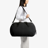 Bellroy Venture Duffel 55L in black, showing spacious main compartment and durable design for travel and daily use.