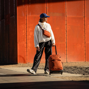 Bellroy Lite Carry-On luggage in ash color, featuring durable exterior and sleek design for easy travel.