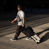 Bellroy Lite Carry-On luggage in ash color, showing its sleek design and compact structure for easy travel.