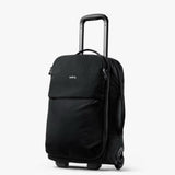 Bellroy Lite Carry-On luggage in ash color, showing its sleek exterior with handle and durable wheels.