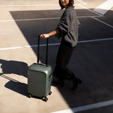 Bellroy Transit Carry-On luggage in bronze, showcasing its sleek design and compact size for travel convenience.