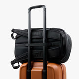 Bellroy Transit Carry-On luggage in bronze with multiple compartments and sturdy handle for convenient travel.