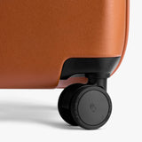 Bellroy Transit Carry-On luggage in bronze, showing its sleek exterior and compact design for travel convenience.