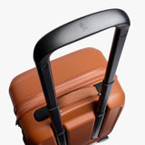 Bellroy Transit Carry-On luggage in bronze showing durable hard shell exterior and compact design for travel.