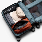 Bellroy Transit Carry-On luggage in bronze featuring sleek design and durable material, ready for travel.