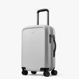 Bellroy Transit Carry-On luggage in bronze color, showing its sleek, compact design with handle and zipper details.