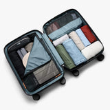 Bellroy Transit Carry-On Large luggage in chalk color, featuring a sleek design with multiple compartments for travel organization.