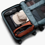 Bellroy Transit Carry-On Large luggage in chalk color, durable carry-on bag with multiple compartments for travel organization.