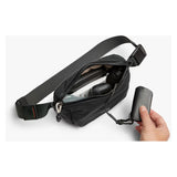 Bellroy Lite Belt Bag in black with adjustable strap, featuring multiple compartments and a sleek, minimalist design for everyday use.