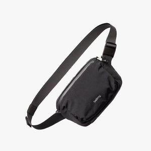 Bellroy Lite Belt Bag showing compact black design with adjustable strap and zippered main compartment.