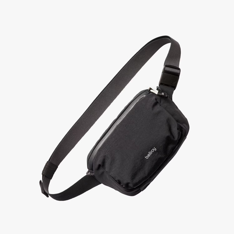 Bellroy Lite Belt Bag showing compact black design with adjustable strap and zippered main compartment.