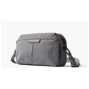 Bellroy Tokyo Crossbody Bag showing sleek black leather exterior with adjustable strap and compact design.