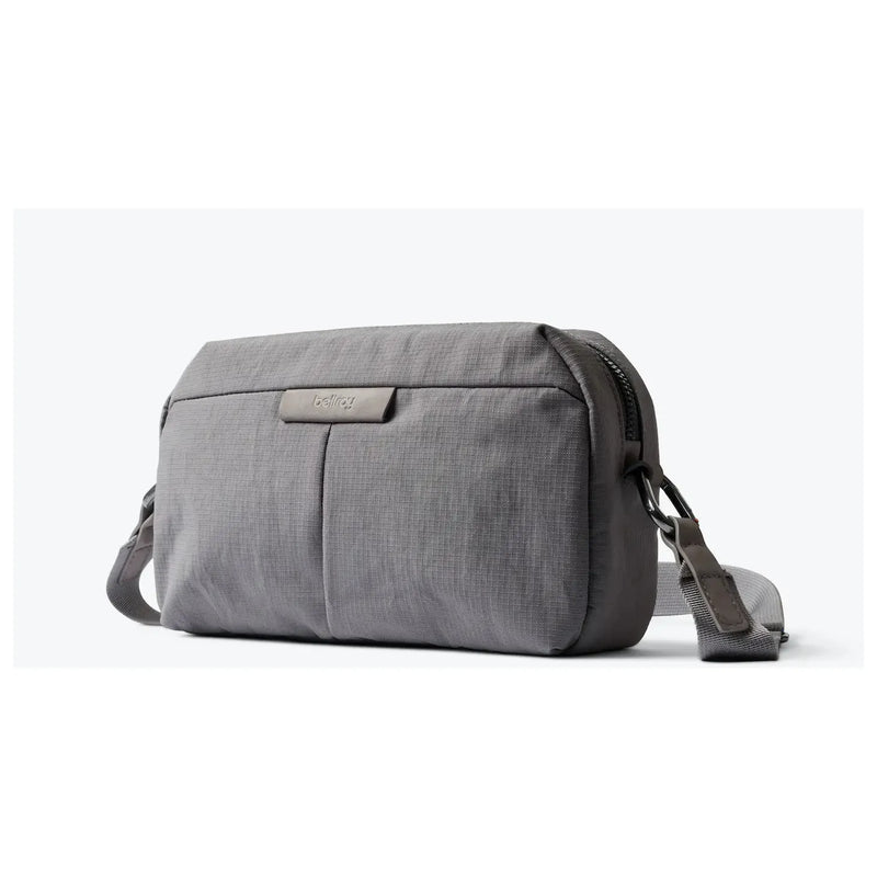 Bellroy Tokyo Crossbody Bag showing sleek black leather exterior with adjustable strap and compact design.