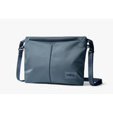 Bellroy Laneway Sacoche 3.5L crossbody bag in ink, featuring compact design with front zipper pocket and adjustable strap.